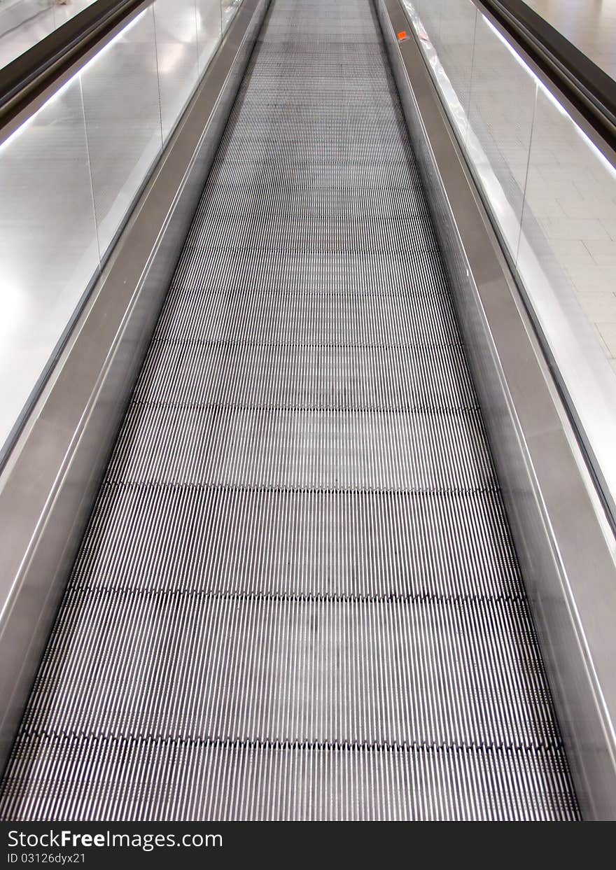 Moving walkway in the arrival hall of the modern airport