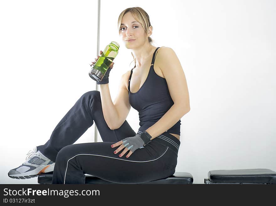 Girl working out towards white background