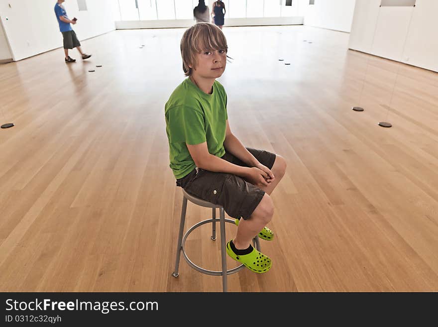 Portrait of a cute boy in the museum