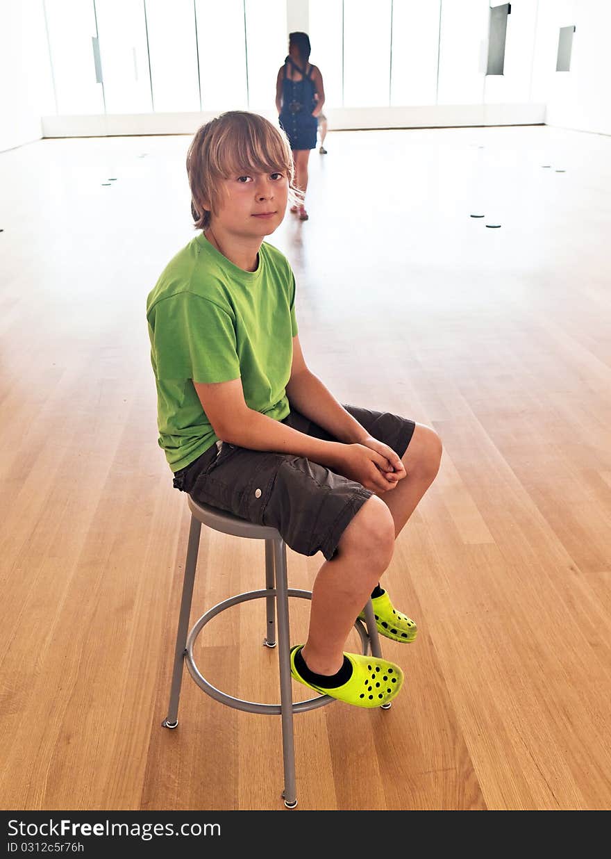 Portrait of a cute boy in the museum