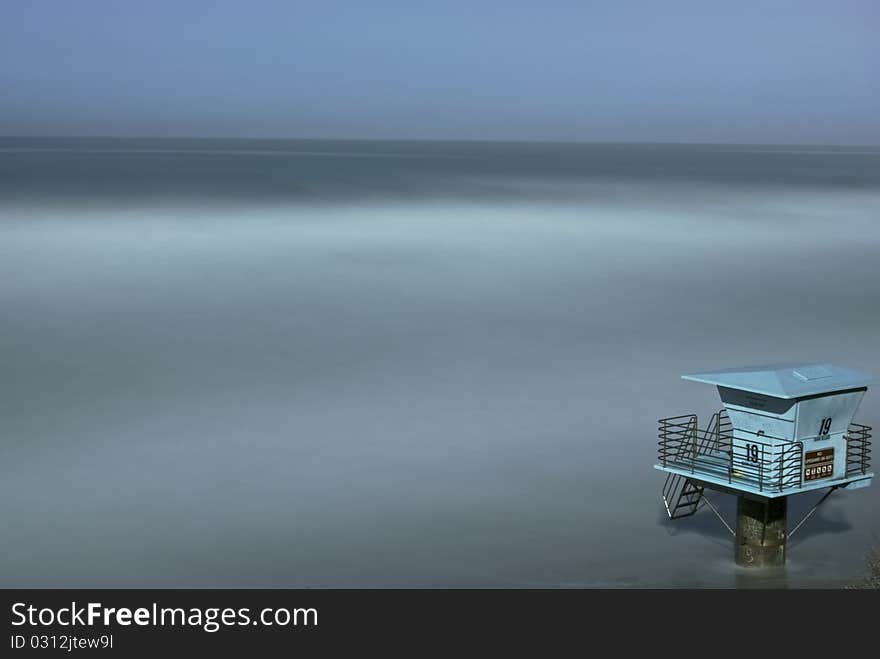 In the middle of the night, a single life guard tower watches over the rising sea created by a nearby tsunami. In the middle of the night, a single life guard tower watches over the rising sea created by a nearby tsunami.