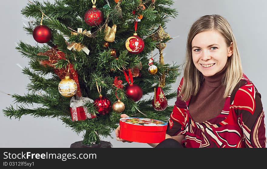 Beautiful christmas girl with a gift. Beautiful christmas girl with a gift