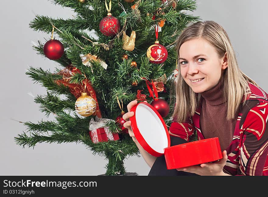 Beautiful christmas girl with a gift. Beautiful christmas girl with a gift