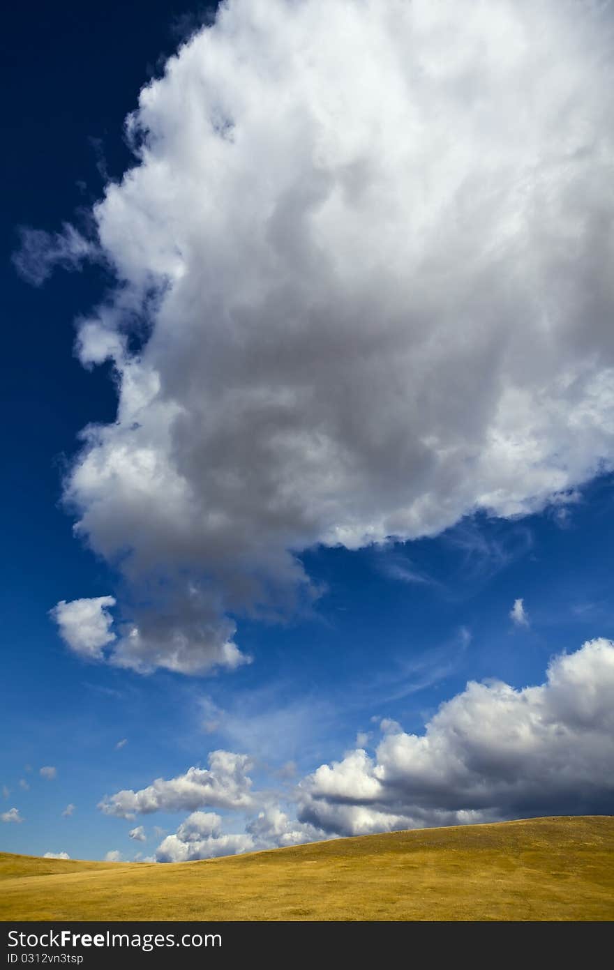 Meadow, clouds and sky on a sunny day. Meadow, clouds and sky on a sunny day.