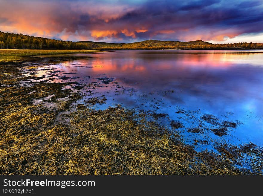 Sunset Under The Lake And Forest