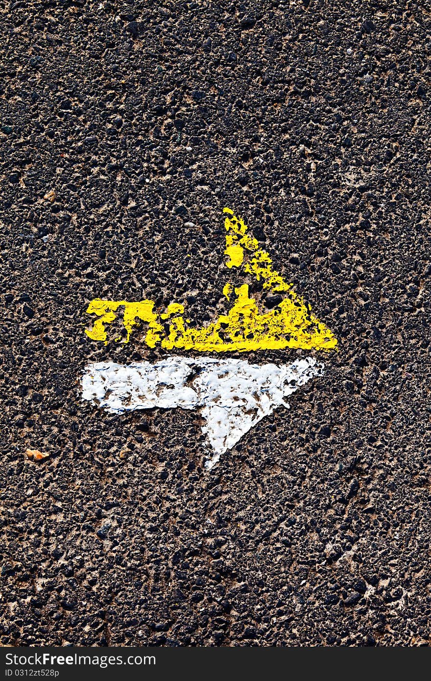 Arrow on a paveway for orientation. Arrow on a paveway for orientation