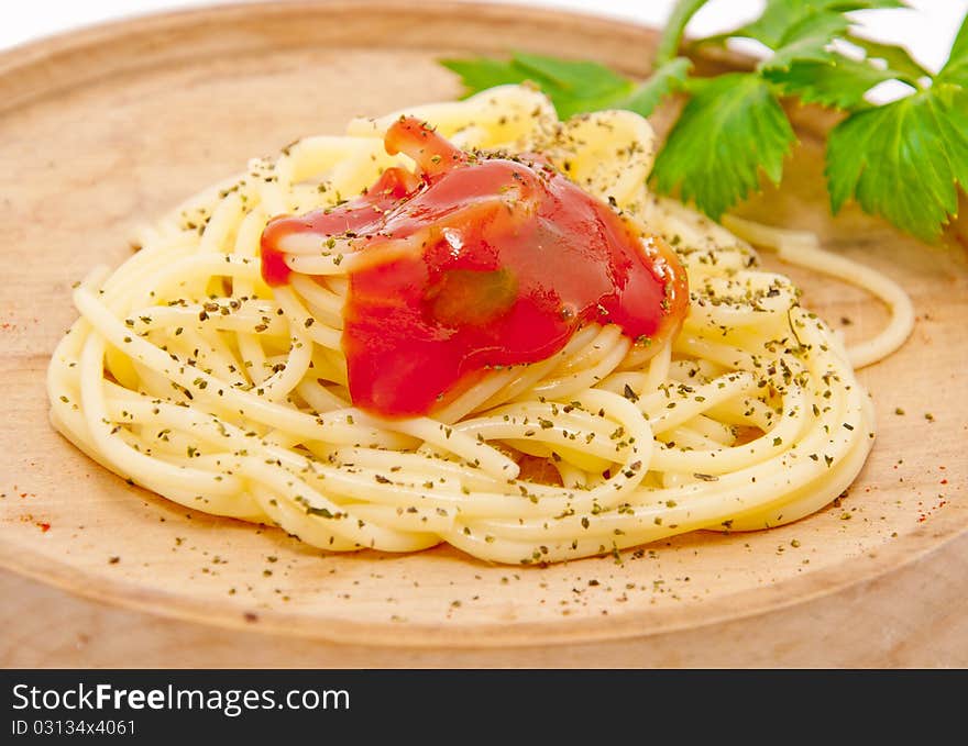 Spaghetti in a wooden plate