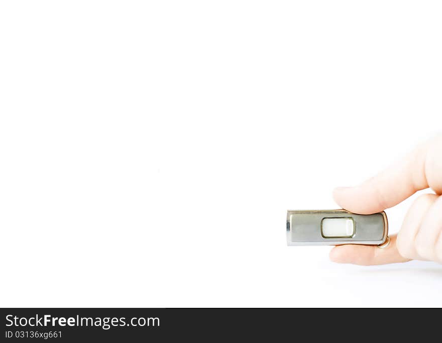 Flash memory stick holded in a hand isolated on white