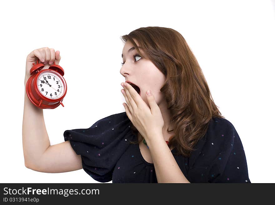 Girl holding alarm-clock isolated on white