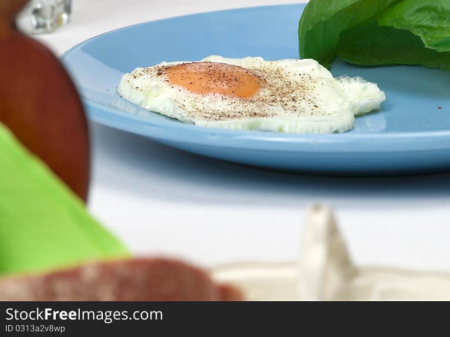 Boiled egg and greens on plate