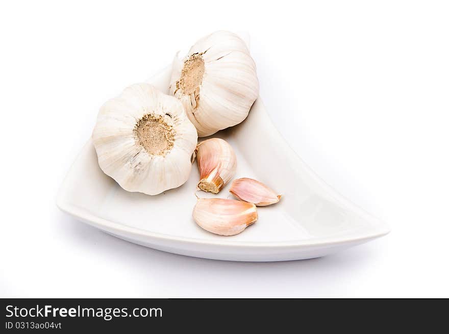 Garlic on a white plate