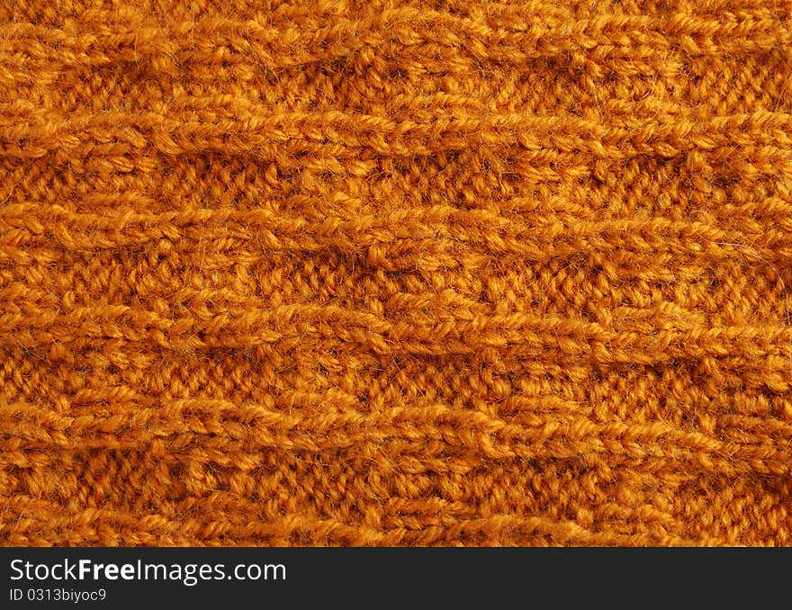 Close-up of knitted cloth with raised tracery