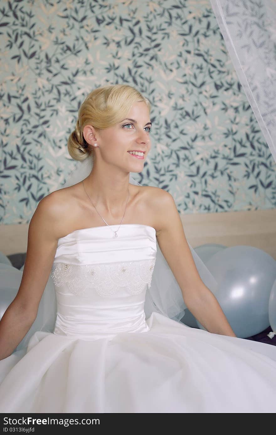 Portrait of a beautiful smiling bride on a sofa. Portrait of a beautiful smiling bride on a sofa