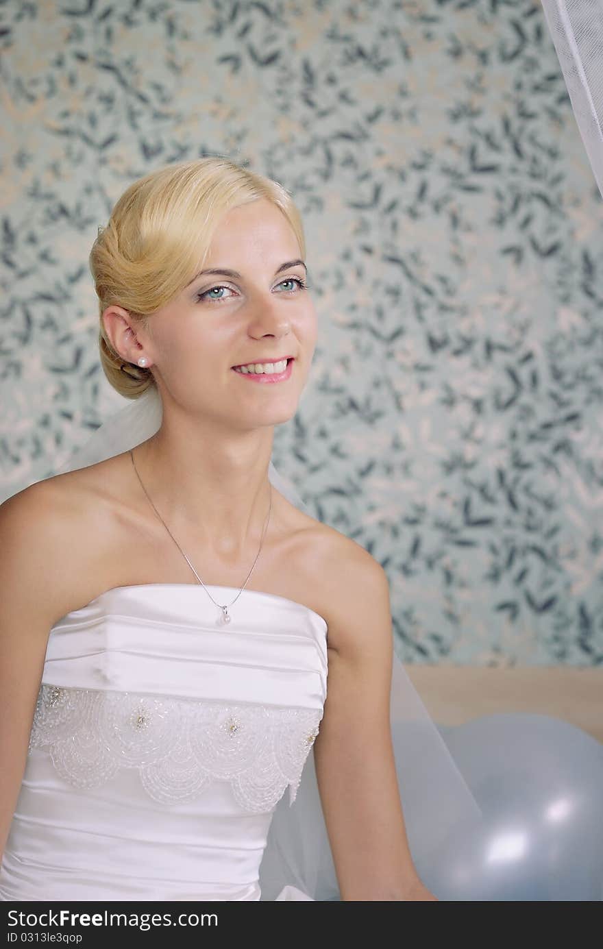 Portrait of a beautiful smiling bride on a sofa. Portrait of a beautiful smiling bride on a sofa