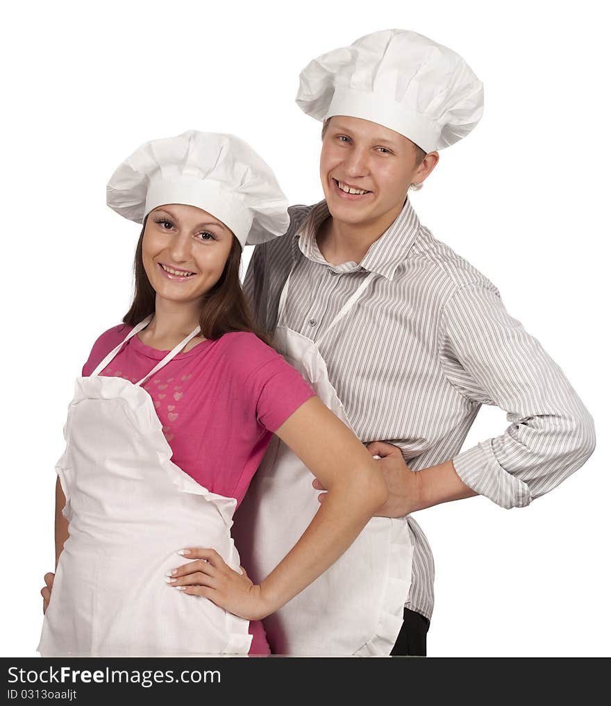 Young loving couple cooks. Over white background