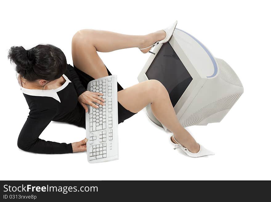 Smiling business woman with a keyboard looking at the screen  isolated over a white background