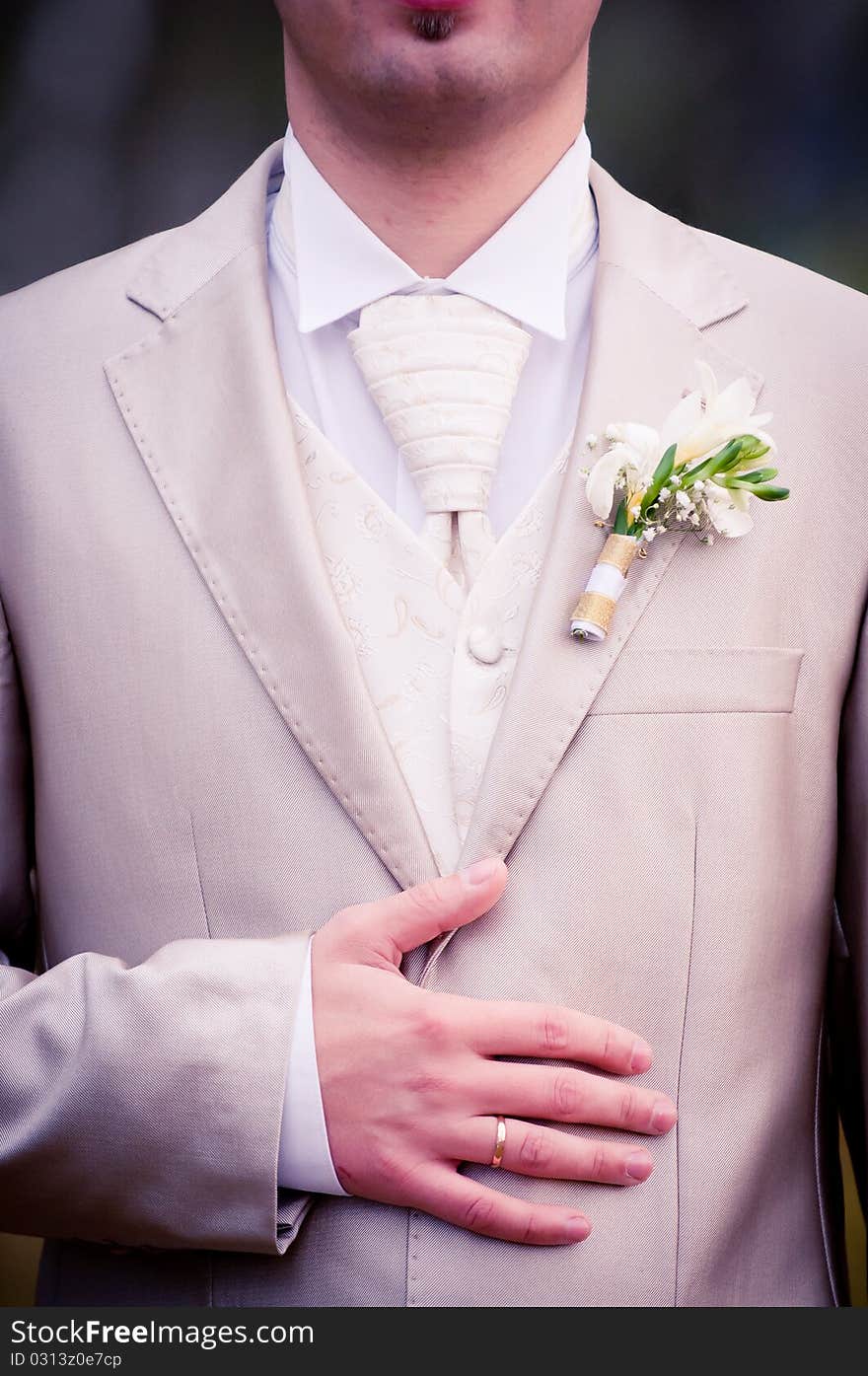 Wedding ring on grooms hand