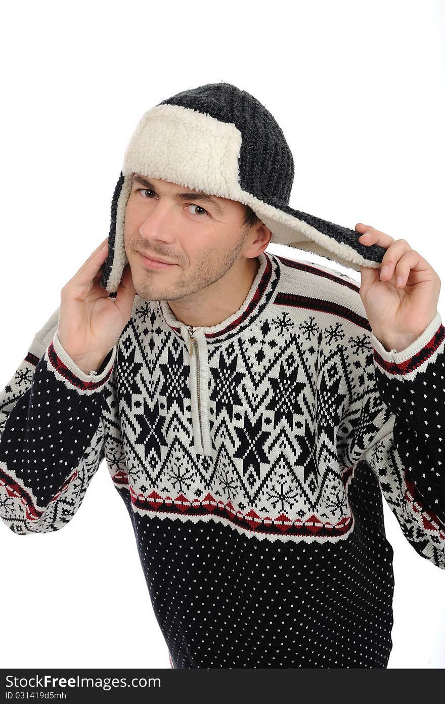 Funny winter man in warm hat and clothes listening