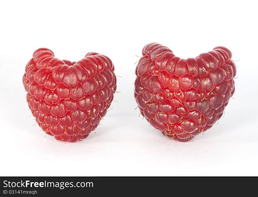 Two raspberries look like two hearts. Two raspberries look like two hearts.