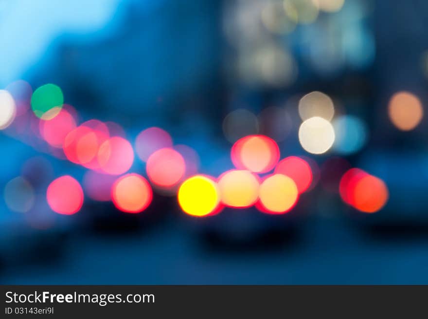 Vehicle traffic at night. The image is defocused. Vehicle traffic at night. The image is defocused