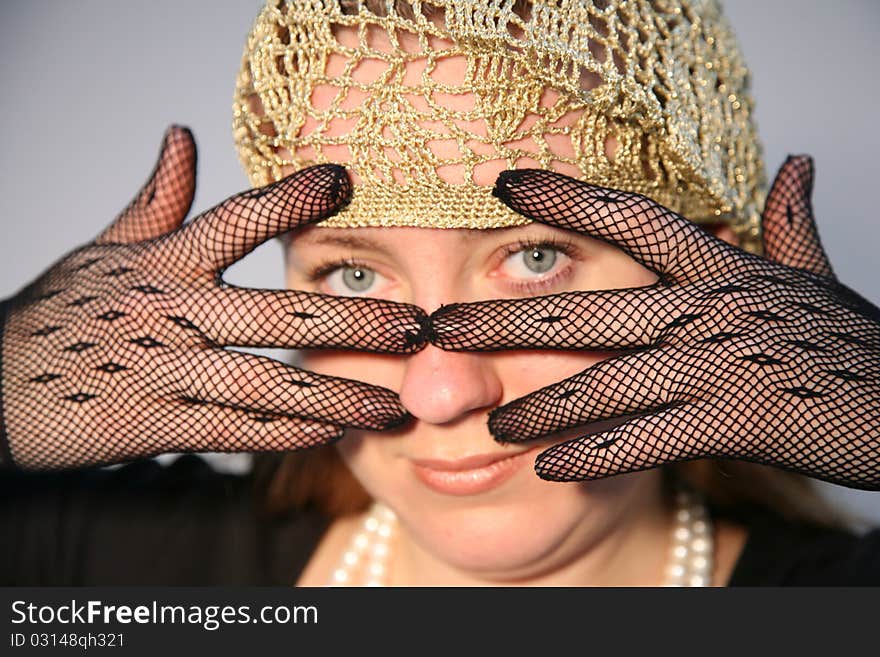 The beautiful sexual girl with long hair in a hat in a retro style.Eyes. The beautiful sexual girl with long hair in a hat in a retro style.Eyes.