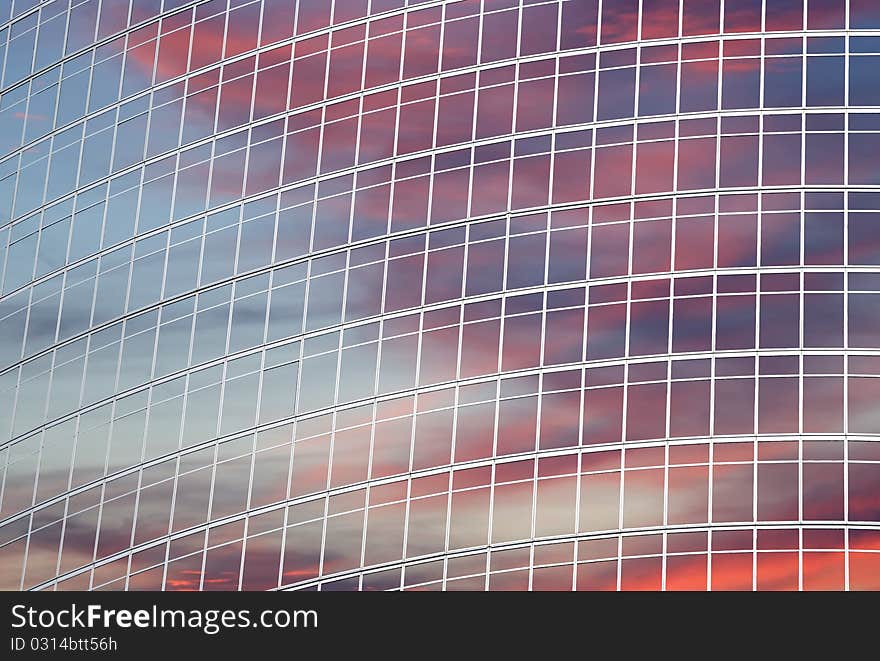 Reflection Of A Cloudy Sky In Glass Wall