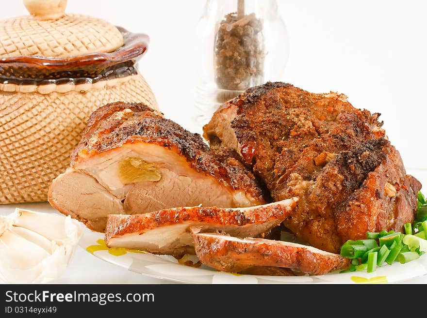 Roasted meat on a plate with spices. Roasted meat on a plate with spices