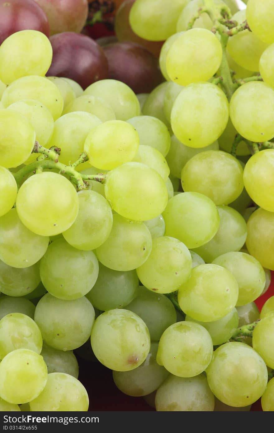 Closeup of a large cluster of green grapes.