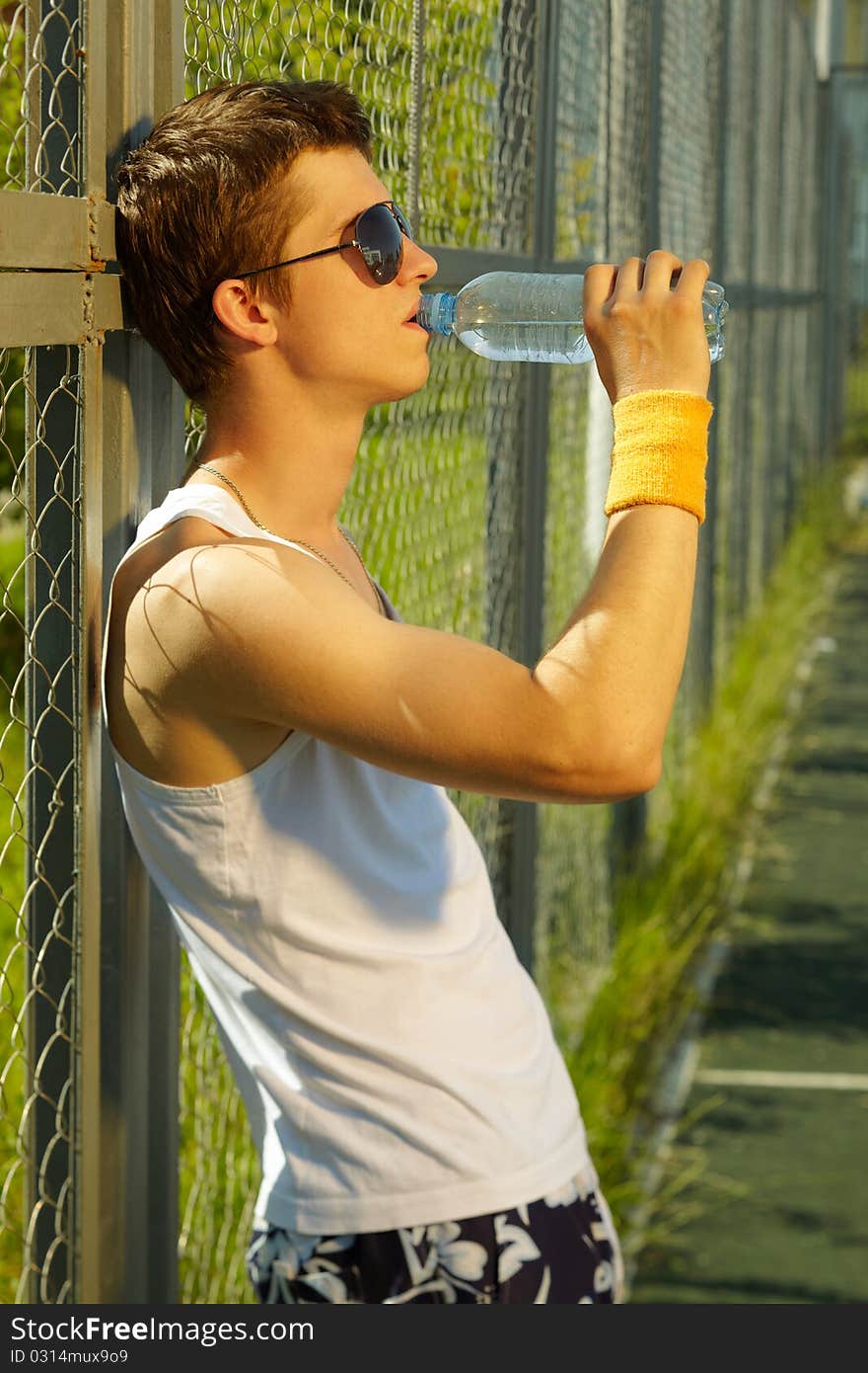 Man is drinking fresh mineral water after sport. Man is drinking fresh mineral water after sport