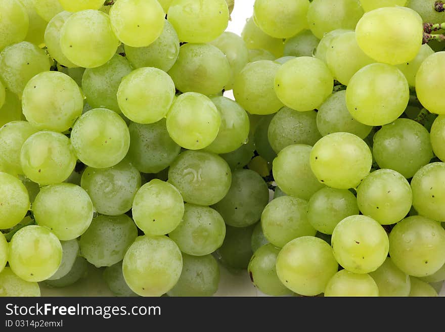 Closeup of a large cluster of green grapes.