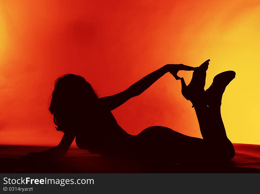 Sexy Girl Silhouette On A Red Background