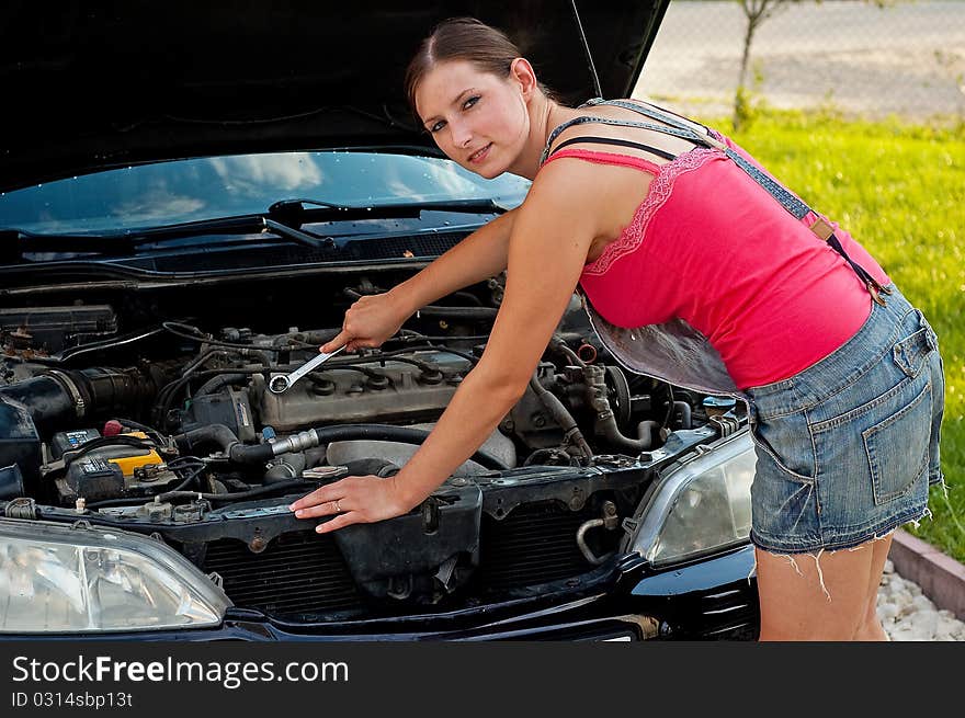 Woman With Her Broken Down Car