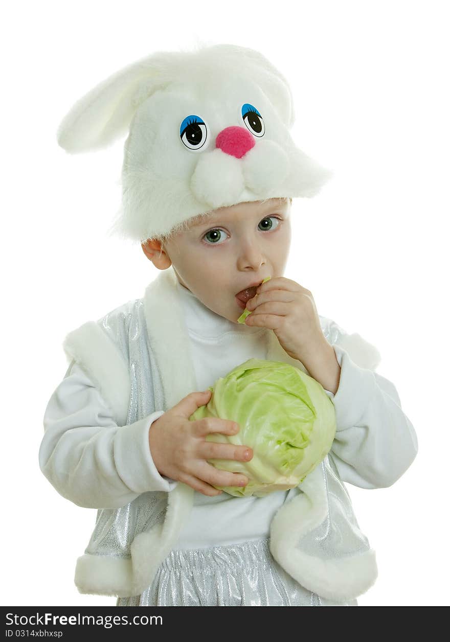 The boy in a suit of a rabbit holds cabbage