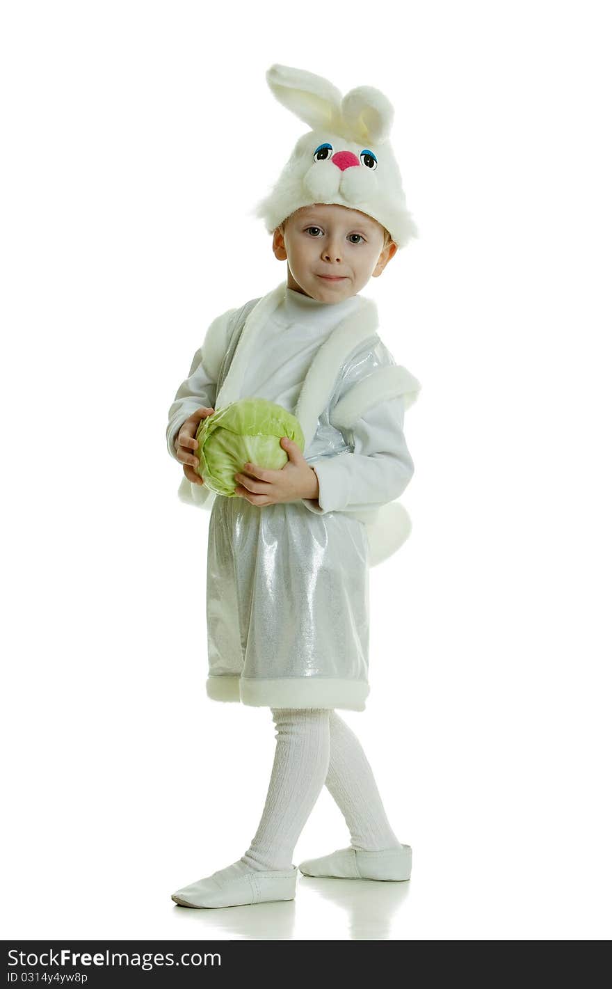 The boy in a suit of a rabbit holds cabbage