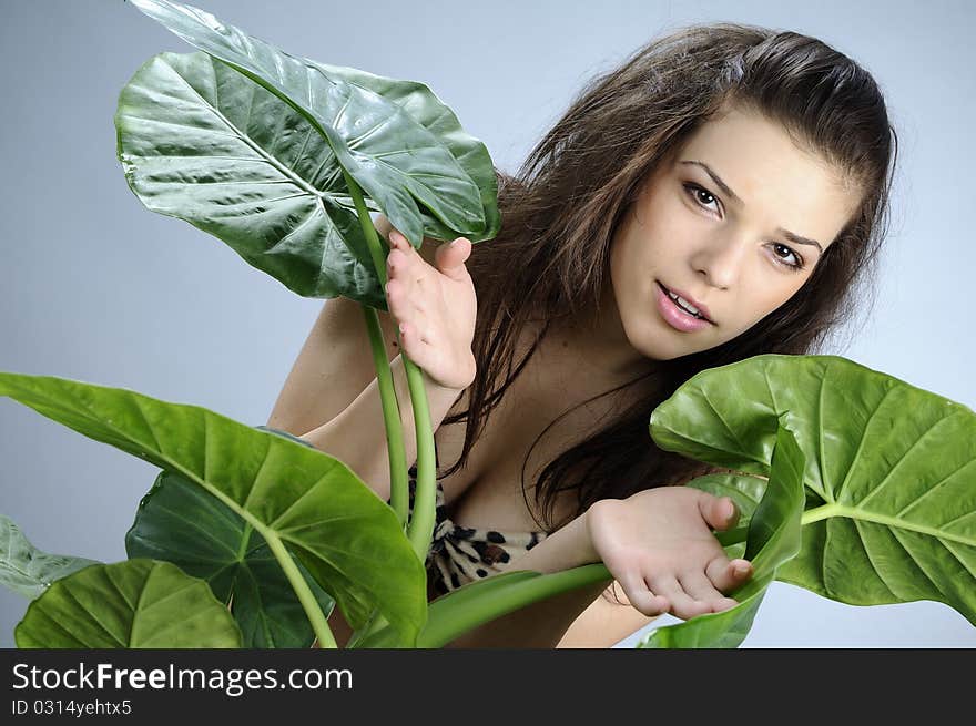 White model simulating hunting with green leaves. White model simulating hunting with green leaves