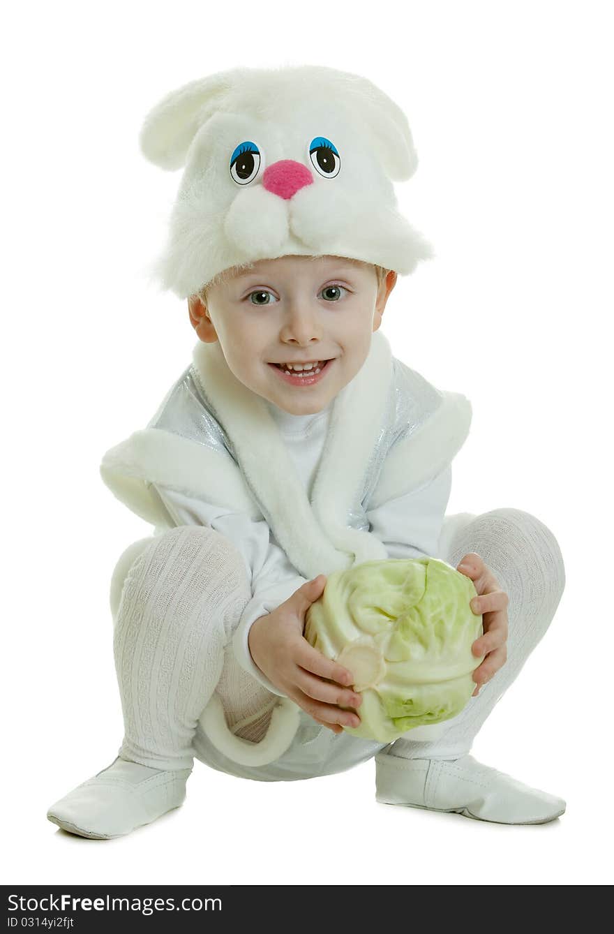 The boy in a suit of a rabbit holds cabbage