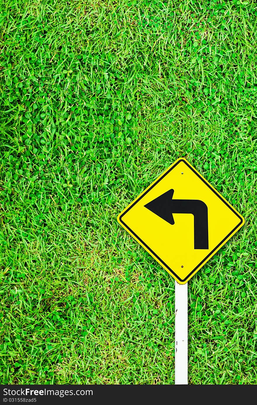 Turn Right Traffic Sign On Grass Field