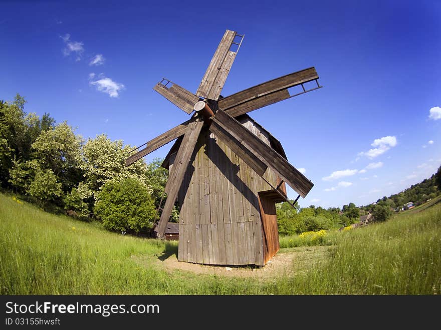 Windmill on green field from Ukraine