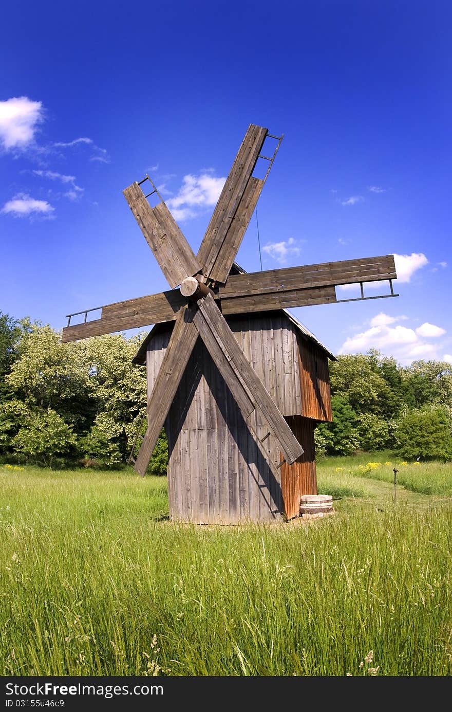 Windmill On Green Field