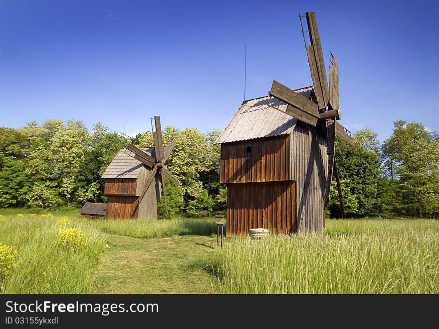 Windmill on green field