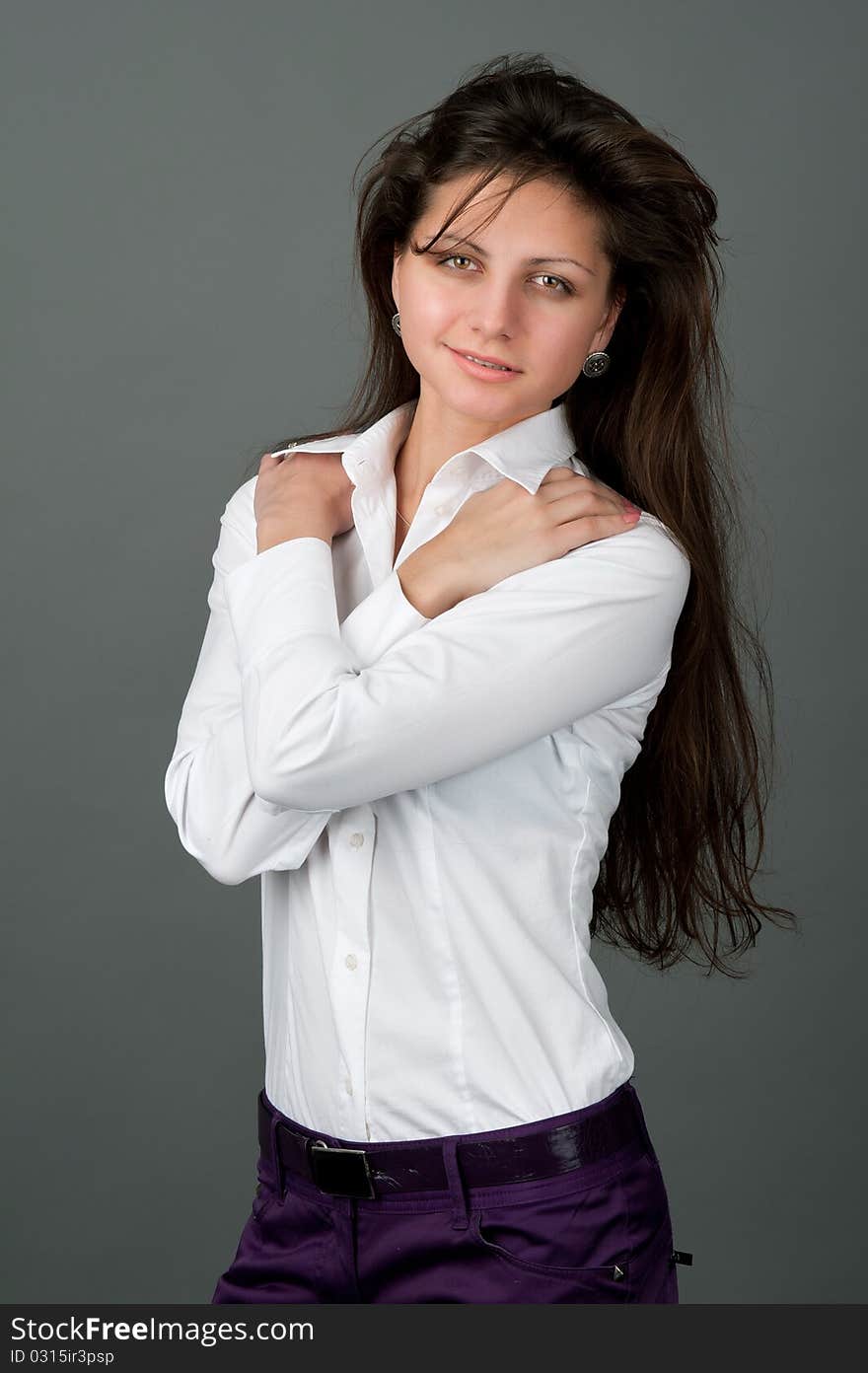 Portrait of pretty young smiling woman with long hair