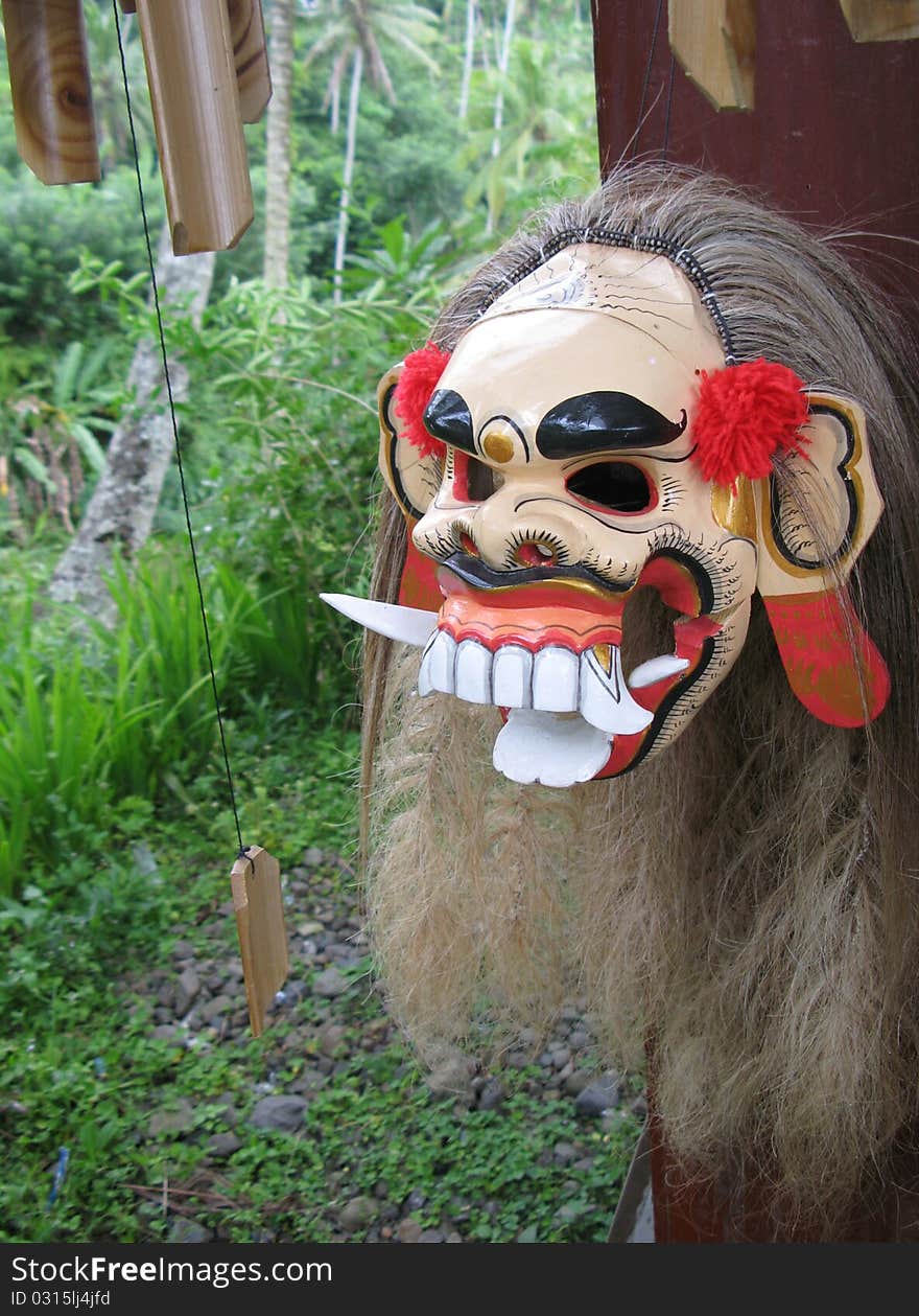 Balinese mask with jungle background