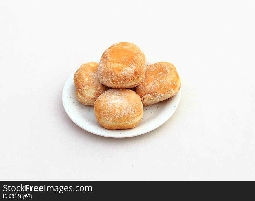 A plate full of doughnuts