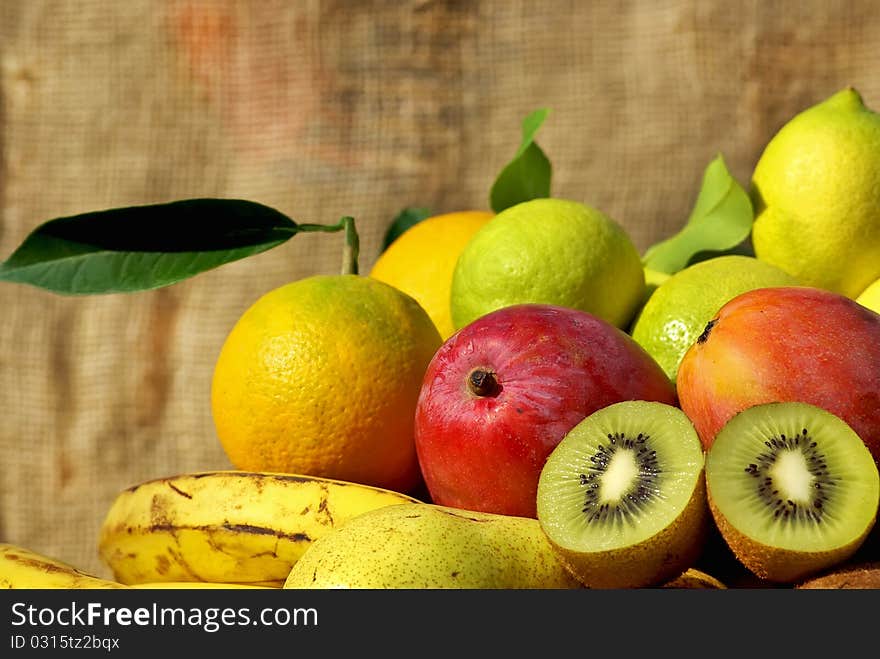 Colored and mature fruits in basket. Colored and mature fruits in basket.