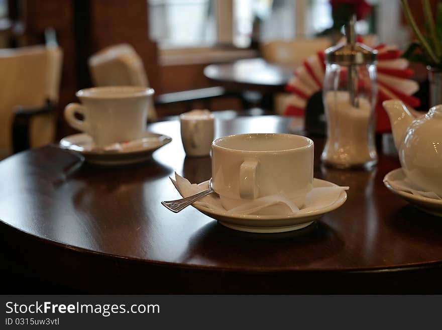 Cups of tea with a teapot