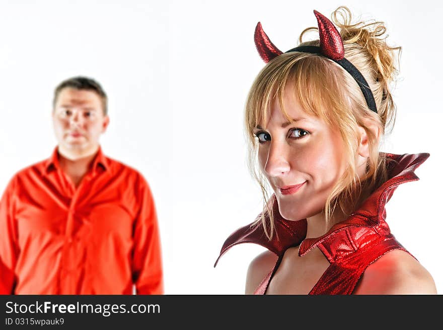 Red devil couple on white background