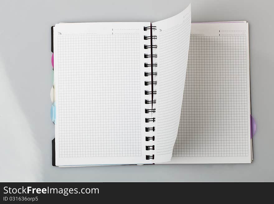 Spiral notebook a gray background