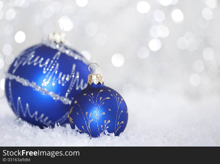 Blue christmas ball on abstract light background. Blue christmas ball on abstract light background.