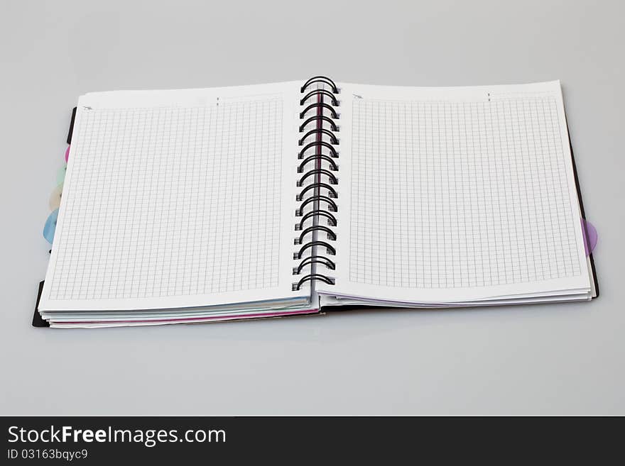 Spiral notebook a gray background