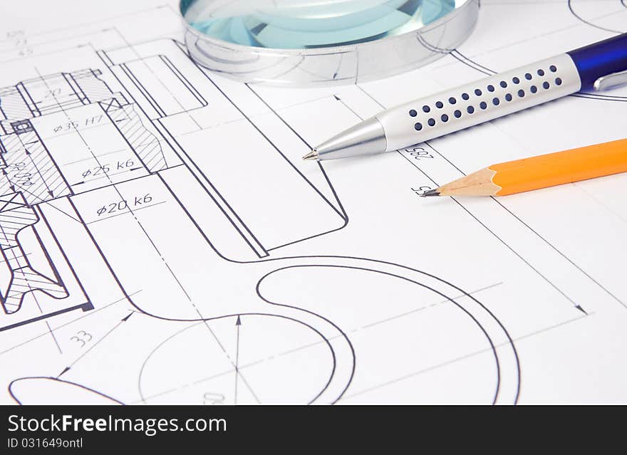 Drafting of crane hook with pencil, pen and magnifier. Drafting of crane hook with pencil, pen and magnifier